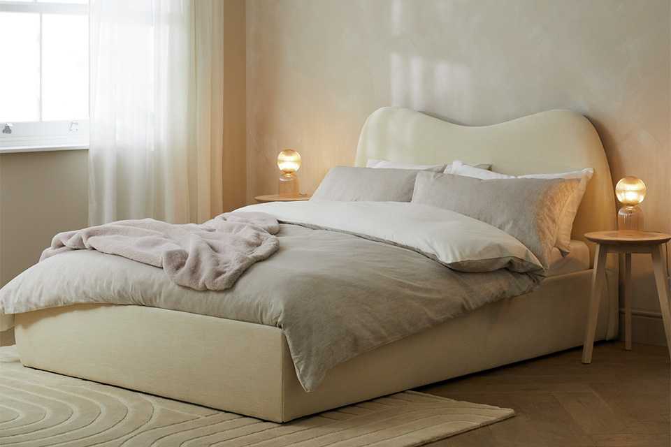 A Habitat ottoman superking size bed in a bedroom.