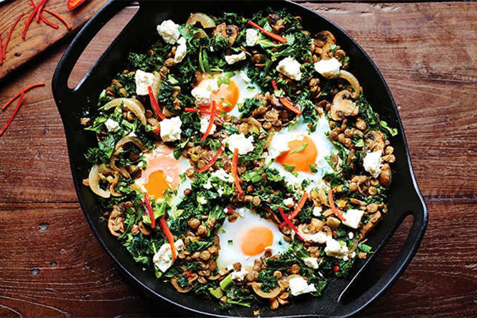 Prepared lentil and egg dish in pan.