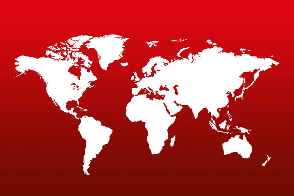 A map of the world on a red background.