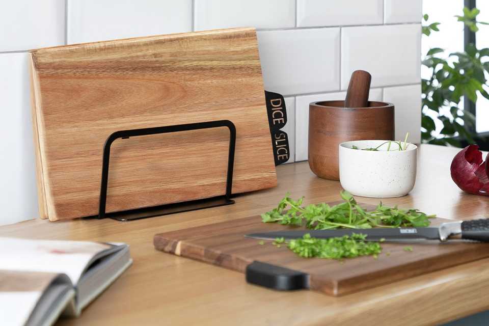 A pack of 3 Habitat industrial acacia wood butcher boards placed on a kitchen counter.