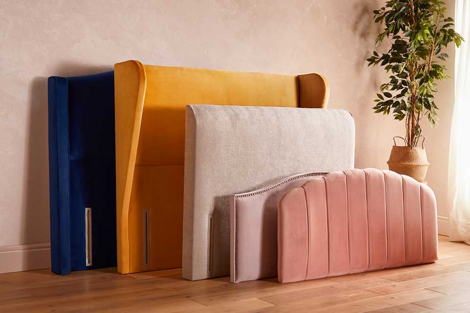 Silentnight headboards in different sizes and colourways kept on wooden floor.