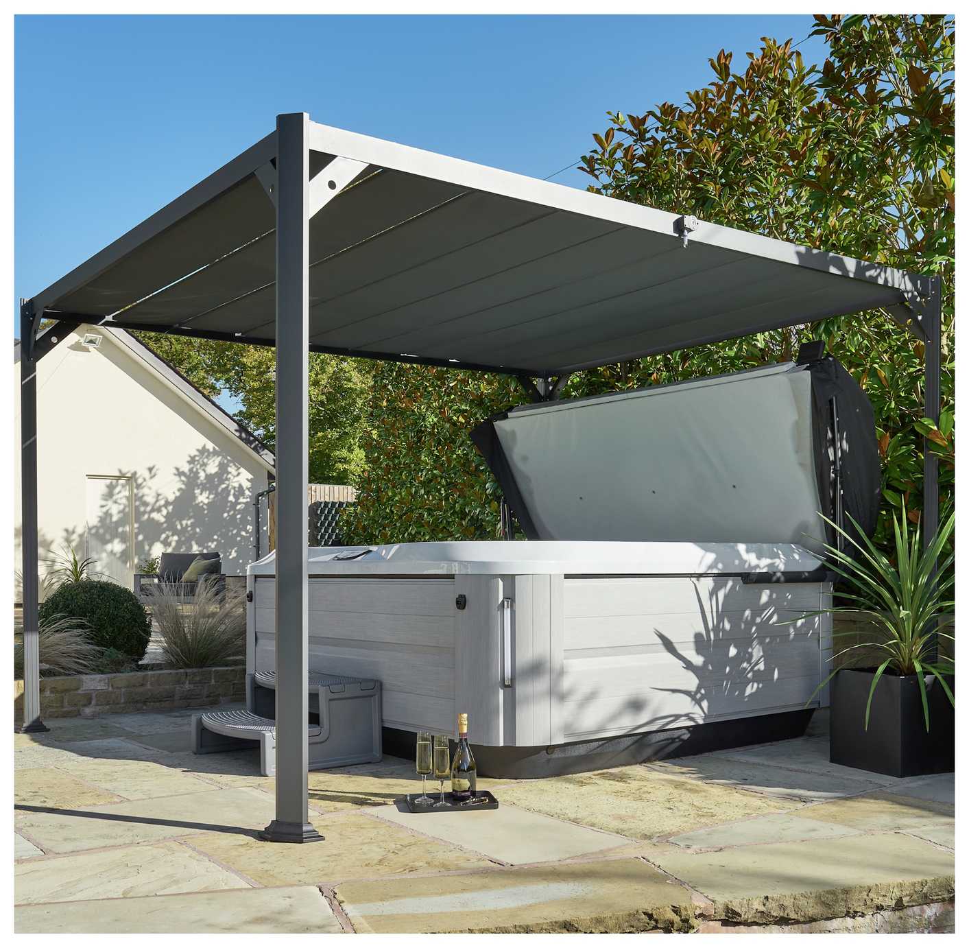 A hot tub placed under Norfolk Leisure Pandora 3m x 3.6m Garden Gazebo in grey colour.
