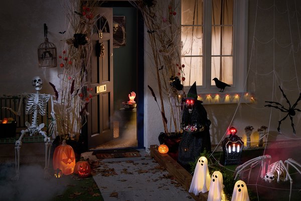 set up of the outside of a house decorated with Halloween decorations