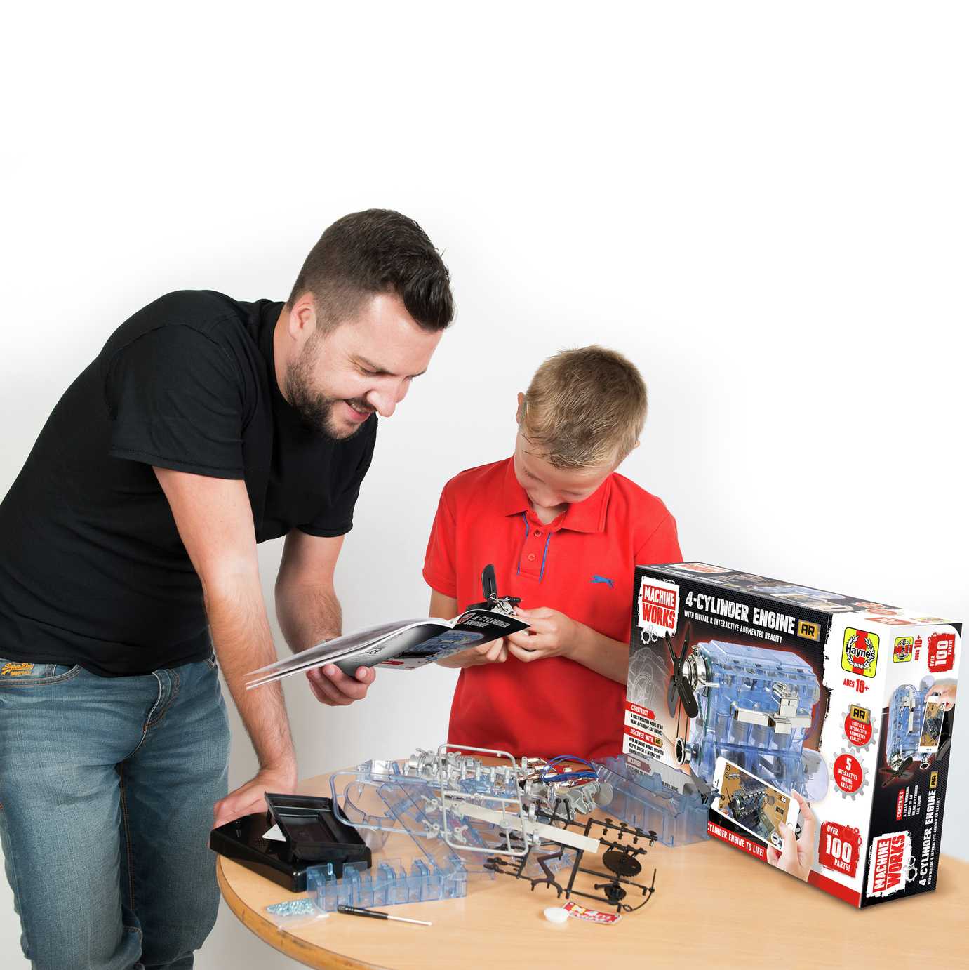 A child playing with a science kit with their parent.
