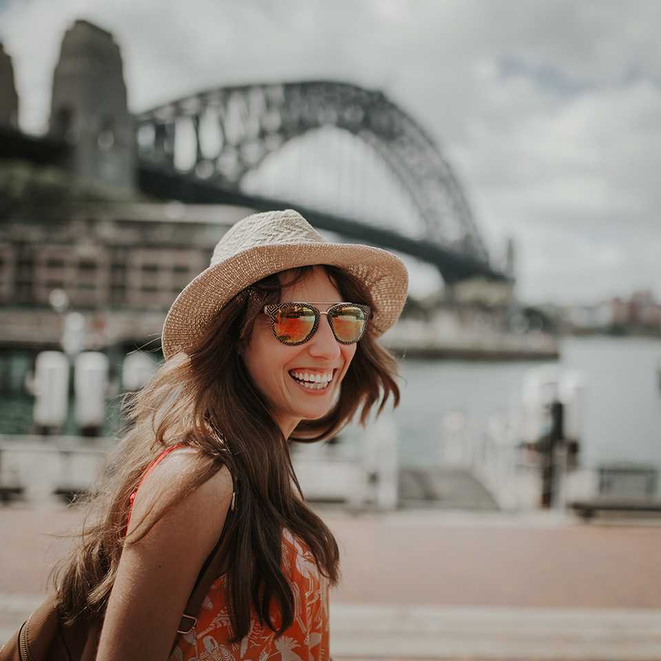 Woman in front of the Sydney Harbour Bridge