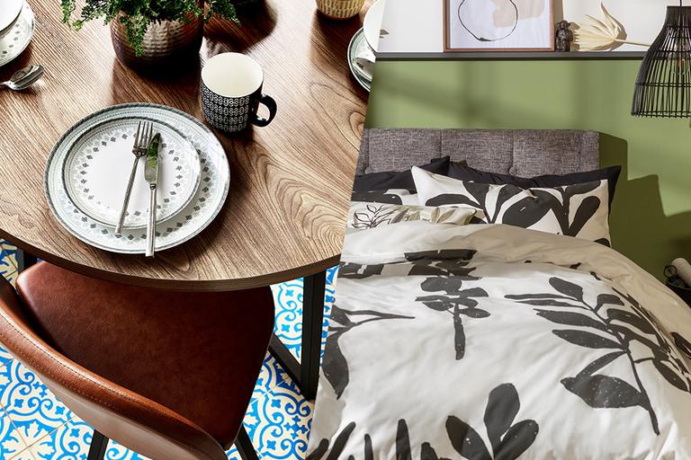 A spilt image of a wooding dining table on one side and a monochrome floral print bedding on the other side.
