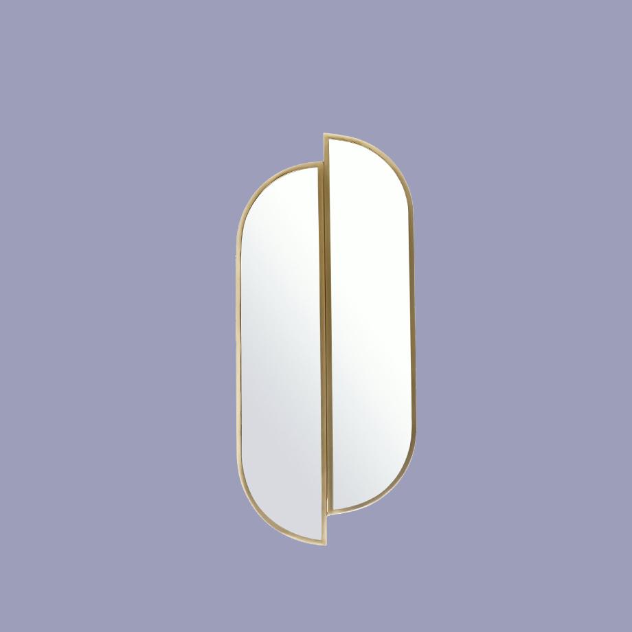 Habitat Pill wall mirror with gold colour border.