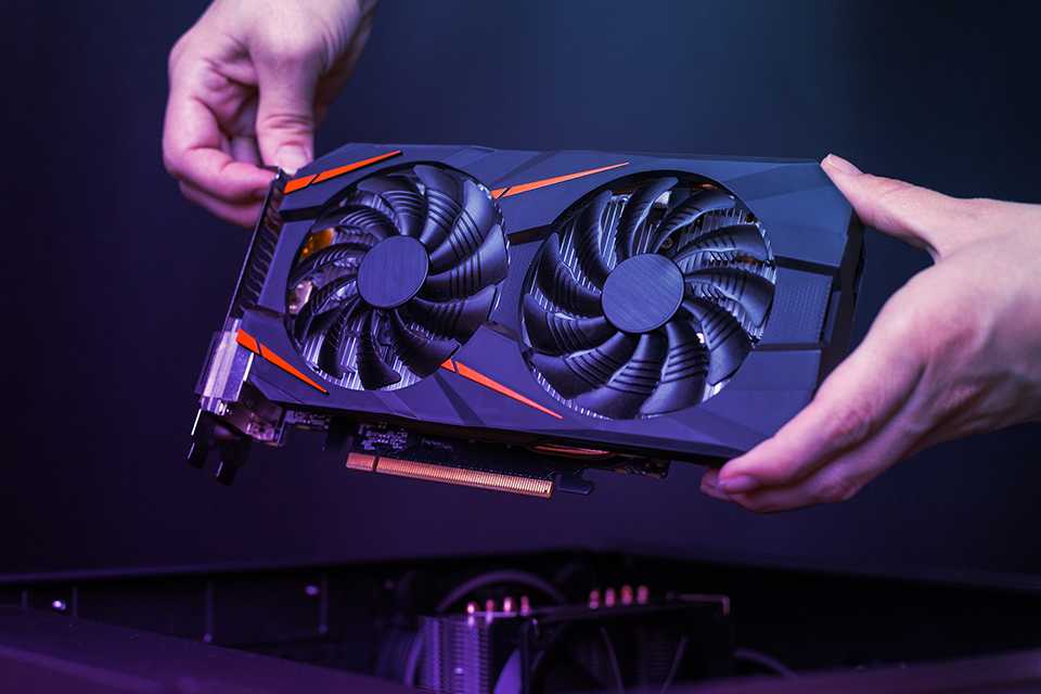 A man holding a graphic card.
