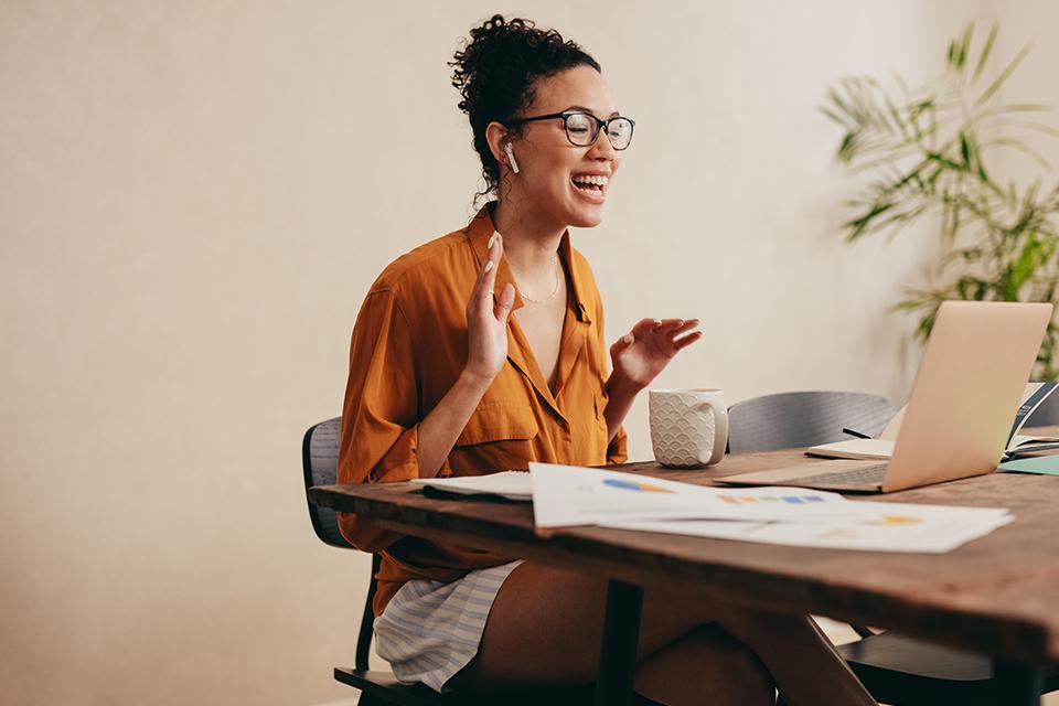 A woman on a video conference call working from home.