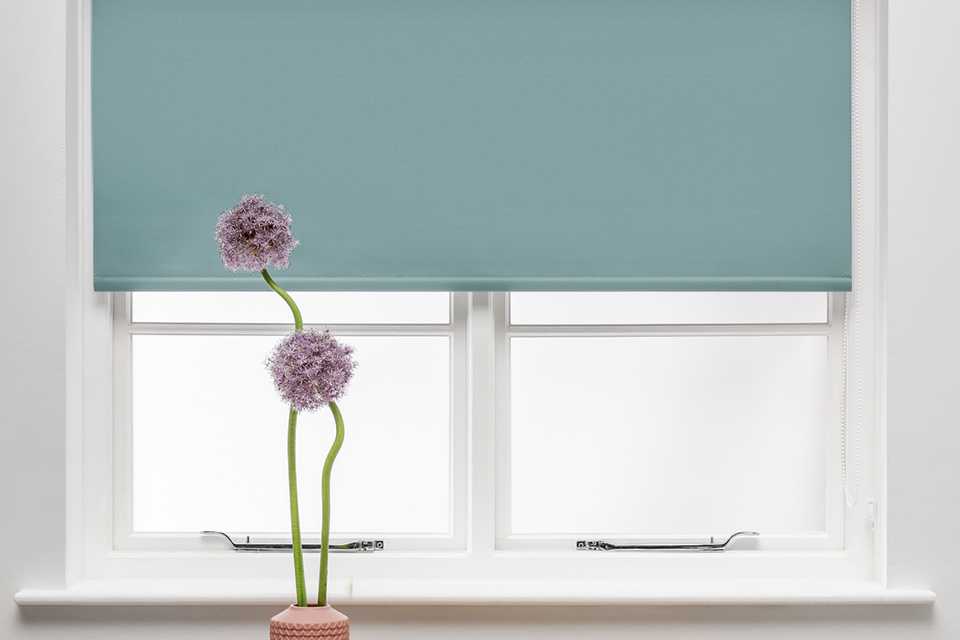 An Argos Home egg shell blue blackout insulating roller.