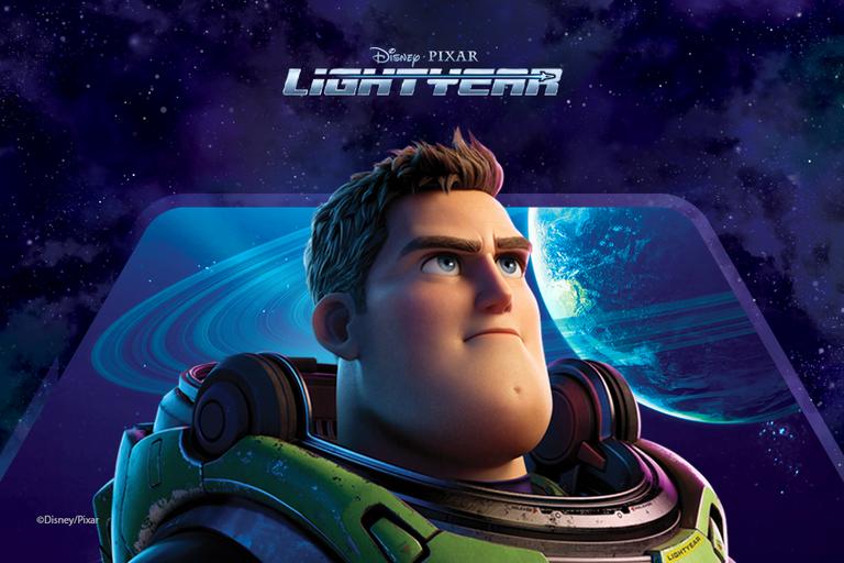 A still from the Pixar movie Lightyear featuring Buzz stood in front of a window overlooking space.