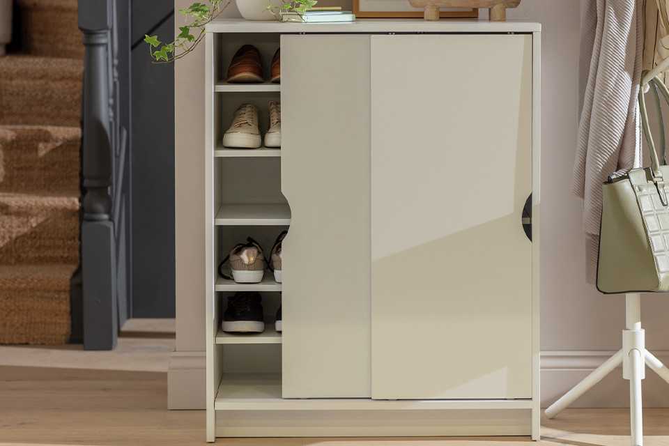 A white Argos Home Chloe 2 door shoe storage cabinet.