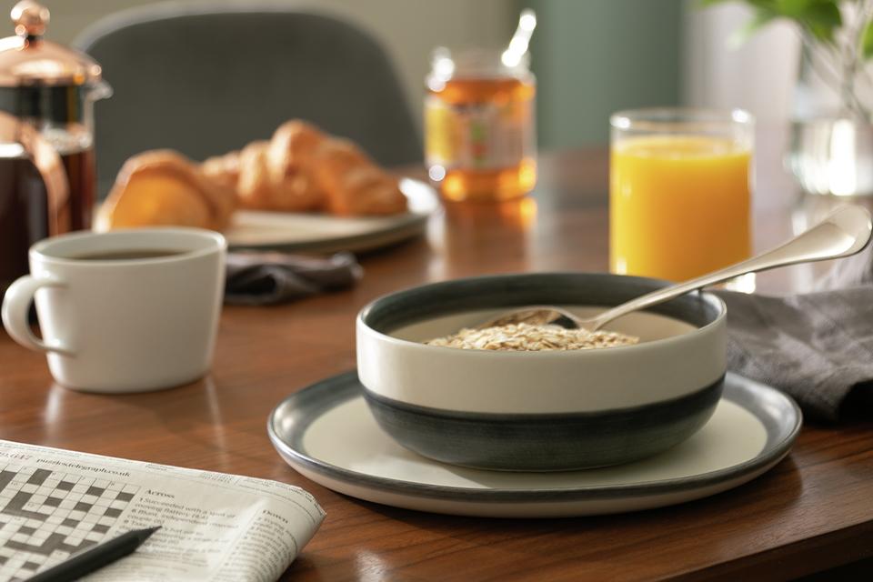 A Habitat stonware dinner set on a dining table.