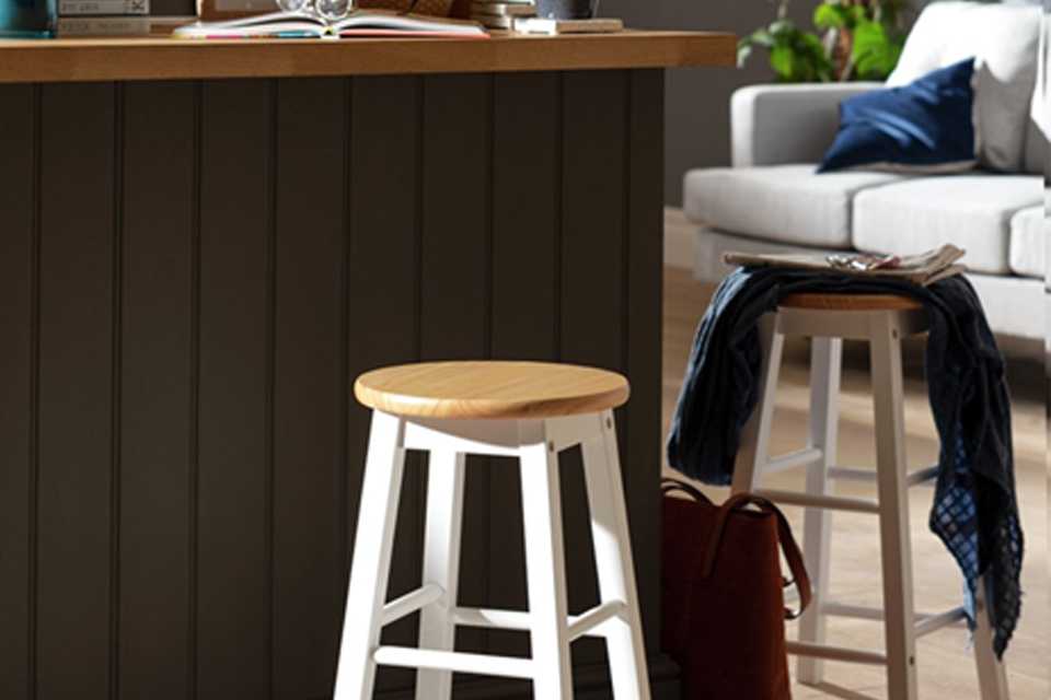 A Habitat pair of wooden bar stools.
