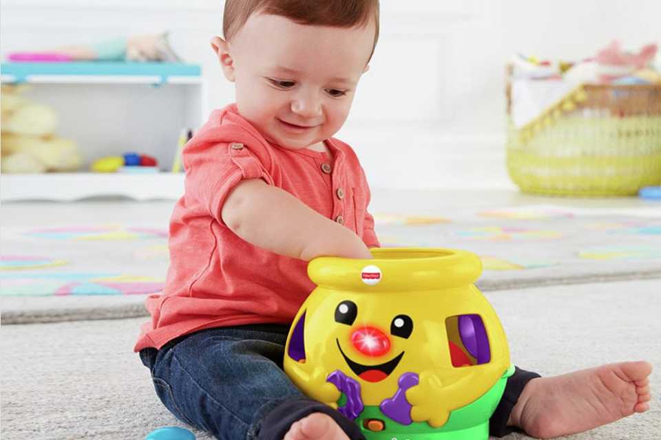 Toddler with shape sorting toy