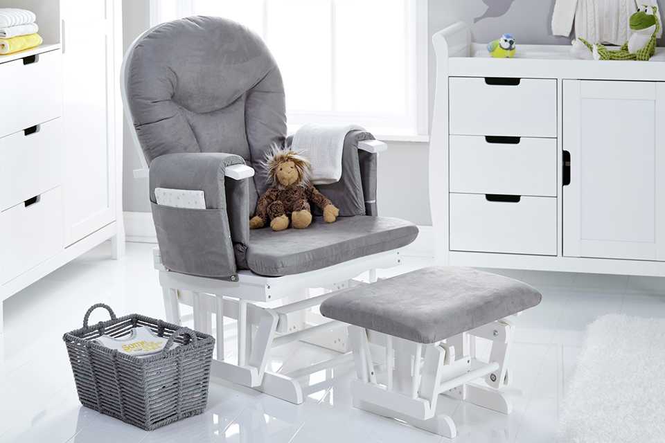 A set of grey nusring chair, basket and a foot stool.