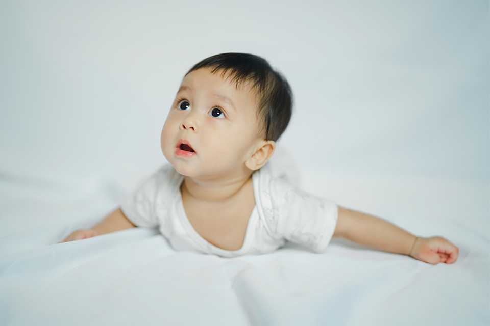 A curious baby looking up.