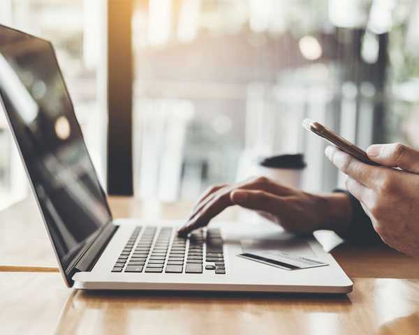 Typing on a laptop