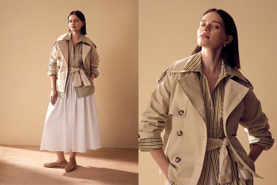 Lightweight neutral trench jacket styled with striped shirt and white midi skirt for spring layering.