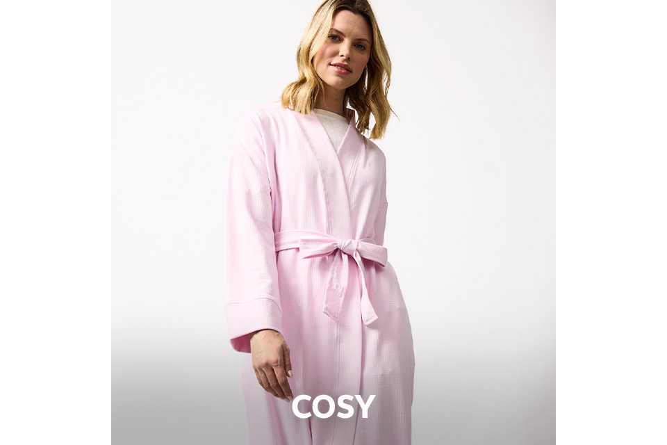 Soft grey women’s cosy loungewear set with tie‑waist top and relaxed trousers.