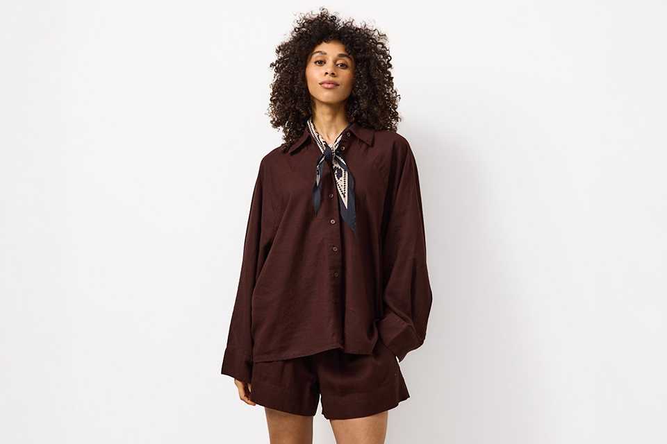 Casual summer outfit styled with a breathable top and relaxed bottoms, perfect for everyday warm‑weather dressing.