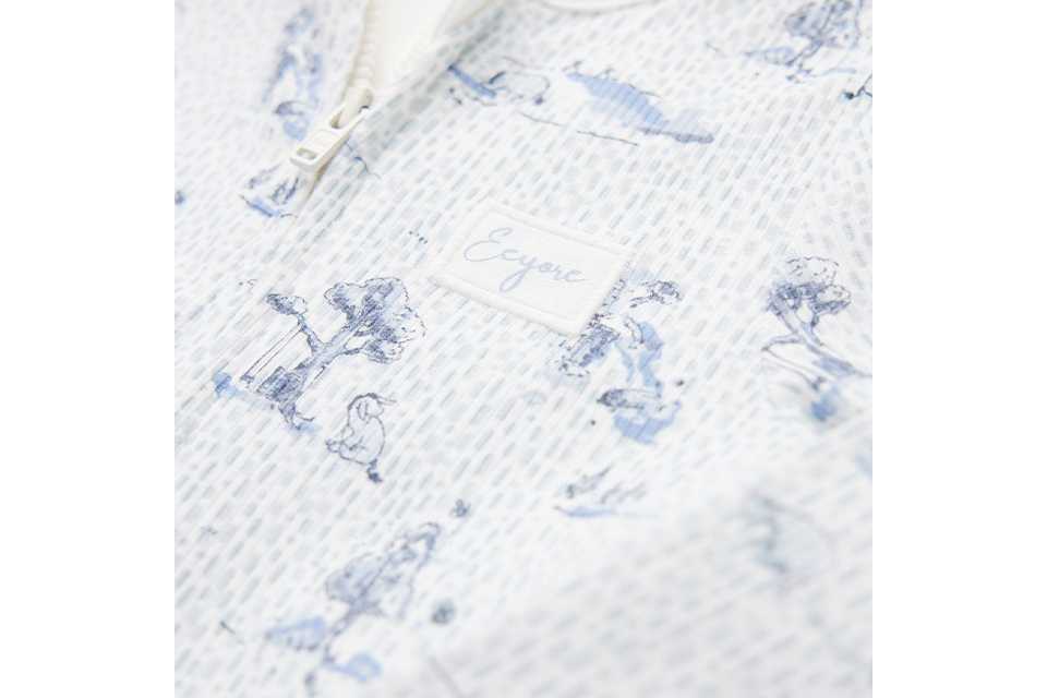 Baby sleepsuit with two‑way zip fastening.