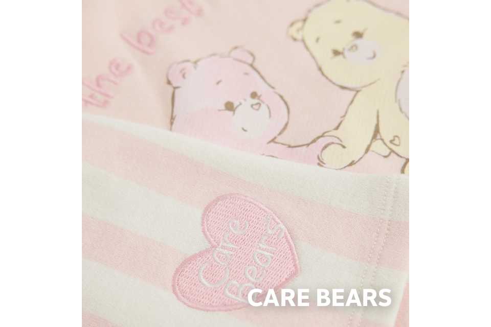 Care Bears baby sleepsuit print in soft cotton.
