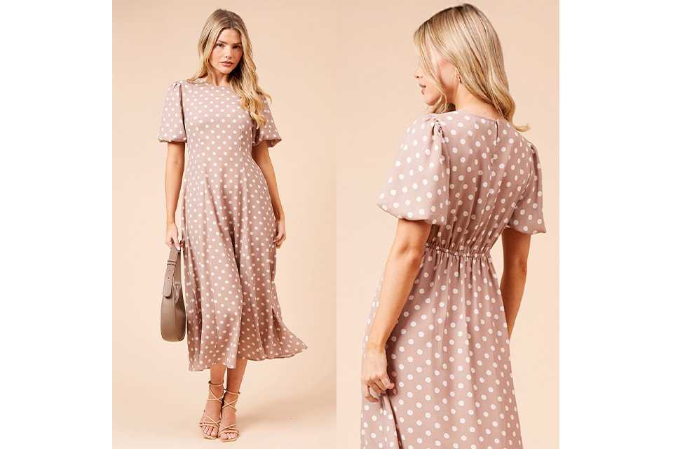 Back view of a polka dot midi dress with soft waist shaping, ideal for spring or summer wedding guests.
