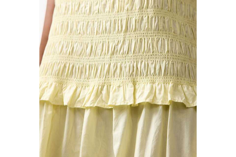 Woman wearing lemonlace maxi dress.