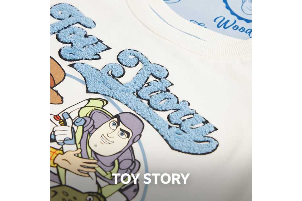 Close up shot of a piece of kids clothing showing a toy story motif.