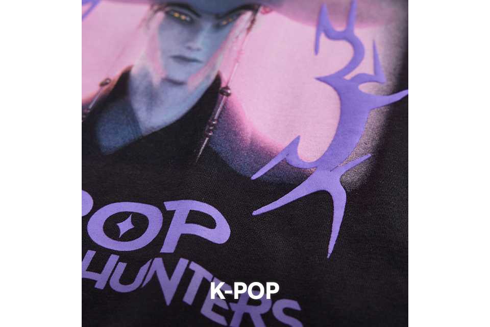 Close up shot of a piece of kids clothing showing a k-pop logo.