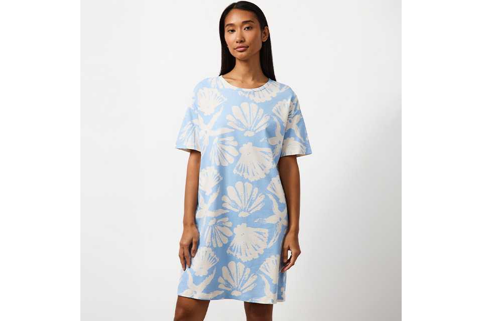 Light blue T-shirt nightdress featuring an all-over white seashell print and a relaxed short-sleeve silhouette.