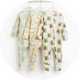 Set of three baby footed sleepsuits featuring playful fruit-inspired prints, including banana, apple juice carton and milk carton designs.