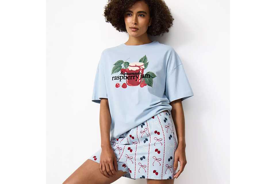 Women's short pyjama set featuring printed T-shirt and shorts, lightweight sleepwear ideal for warmer nights.