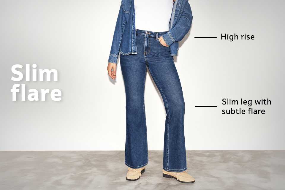 High-rise slim flare jeans in dark denim with subtle flare at the hem and slim leg fit, styled with boots.