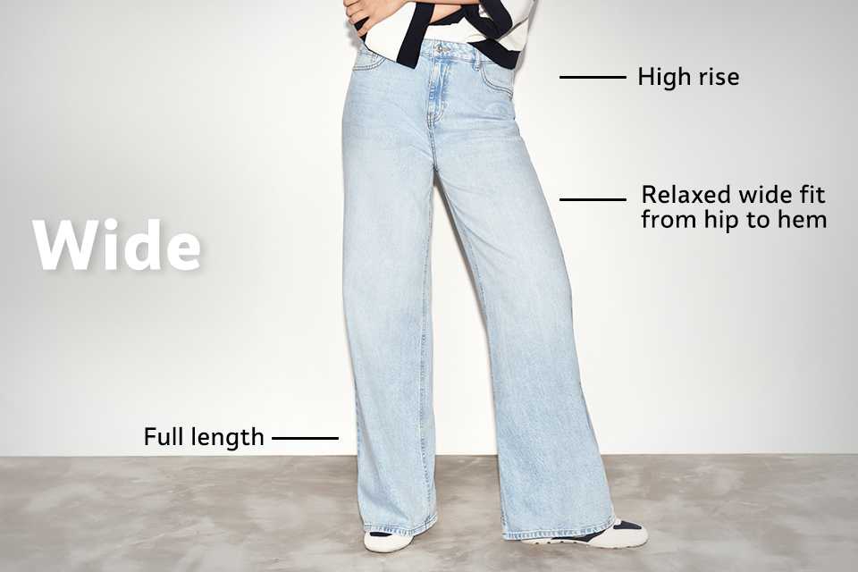 High-rise wide-leg jeans in light blue denim with relaxed fit from hip to hem and full-length design, styled with trainers.