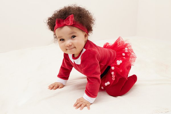 Baby Christmas gifting. Treat your newest arrival to our cute and cosy gifting range. From snuggly sleepsuits to festive accessories, share the joy this season.