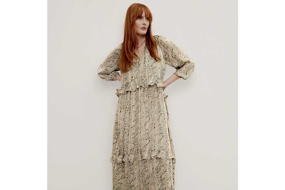 Woman wearing floral maxi dress.