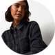 Dark wash denim overshirt with front patch pockets and button fastening, styled for a casual women's denim look.