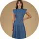 Blue denim midi dress with flutter sleeves, button-front detail, and a fitted waist, styled with heeled sandals.