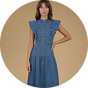 Blue denim midi dress with flutter sleeves, button-front detail, and a fitted waist, styled with heeled sandals.
