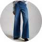 Blue high-waisted wide-leg jeans styled with a grey knit jumper and black ankle boots.