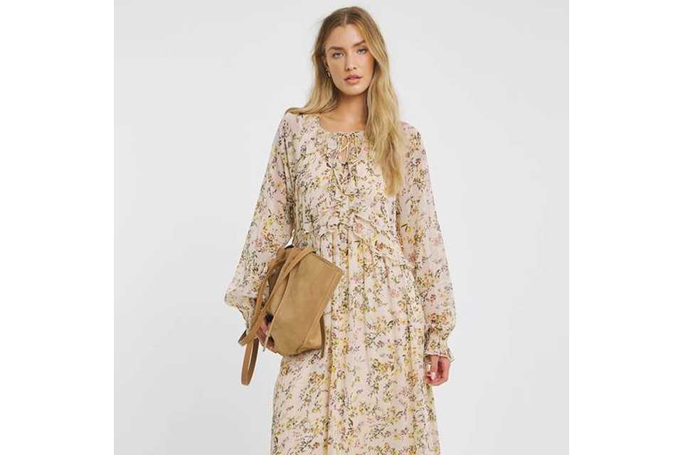 Woman wearing floral maxi dress.