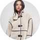 Woman wearing cream shearling coat.