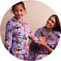 Matching festive Christmas pyjamas for a cosy seasonal night in with friends.