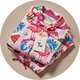 Wrapped Christmas pyjama gift set with festive character print nightwear.