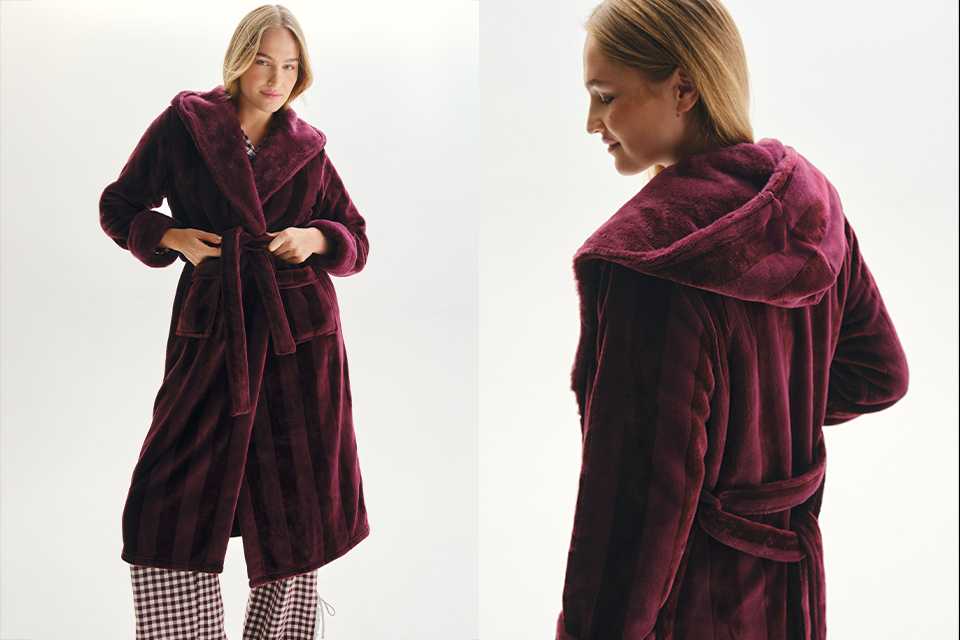 Burgundy hooded plush robe coat with a tie-waist belt and soft textured fabric, viewed from the back and side, showcasing cozy loungewear styling.