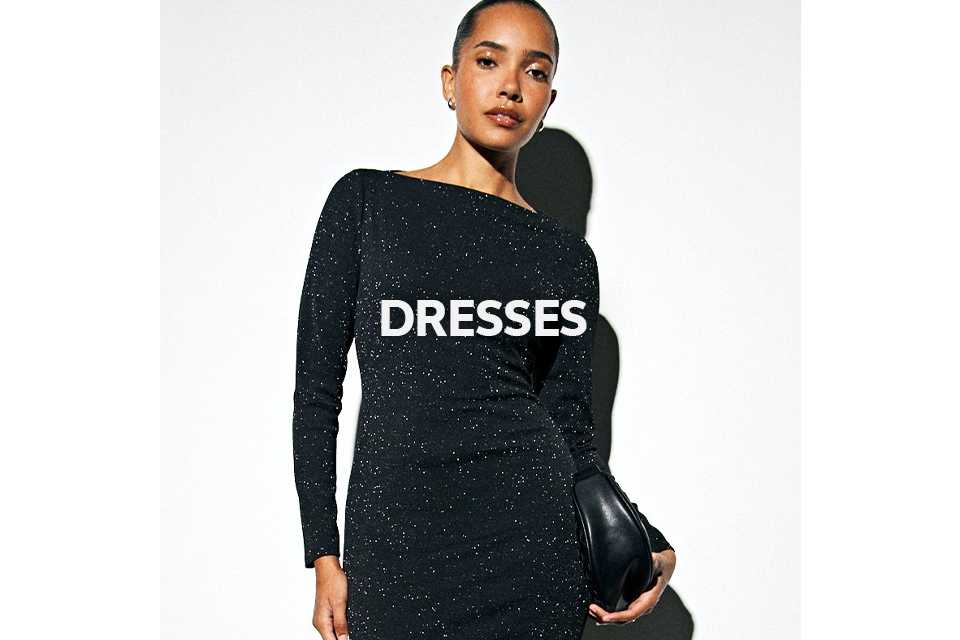 Woman wearing black long sleev shimmer midaxi dress.