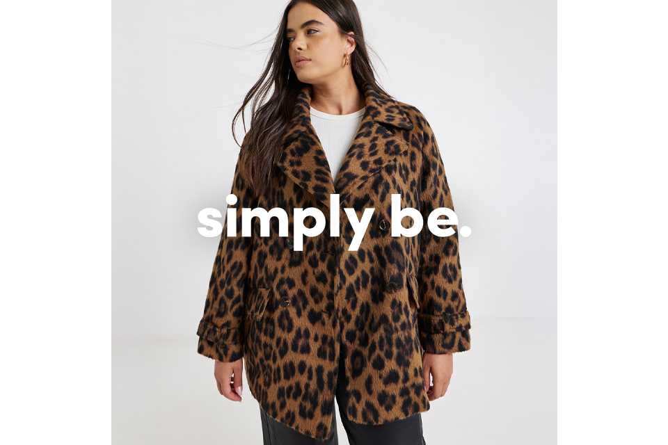 A woman wearing pink and burgundy sequin cardigan.