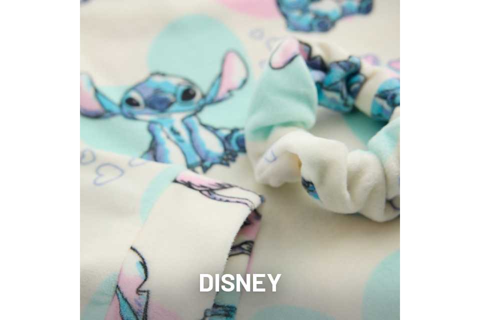 Light blue fabric with printed characters from Disney’s Lilo & Stitch, showing Stitch in various playful poses.